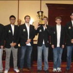 UT Dallas "A" team (left to right): GM Valentin Yotov, GM Julio Sadorra, TD Guadalupe in background, GM Cristian Chirila, IM Salvijus Bercys, IM Conrad Holt & IM Milos Pavlovic
