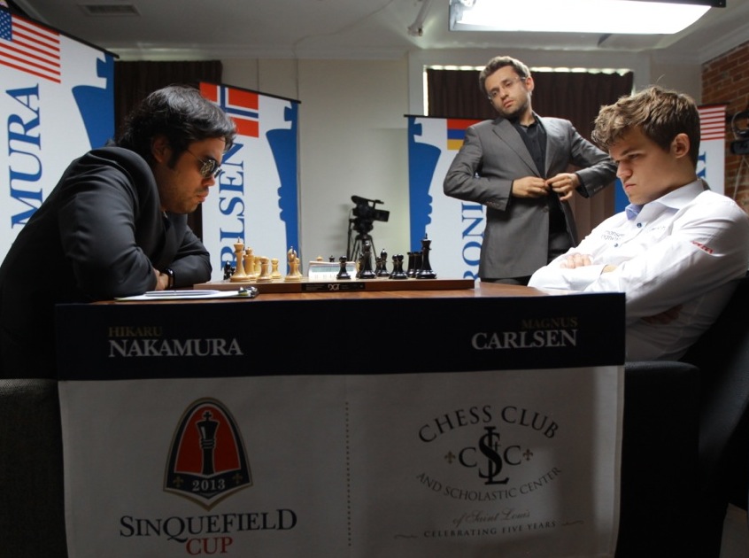 Hikaru Nakamura and Magnus Carlsen at the Sinquefield Cup in Saint Louis. Levon Aronian in background, observes the game. Photo Couretesy Saint Louis Chess Club.